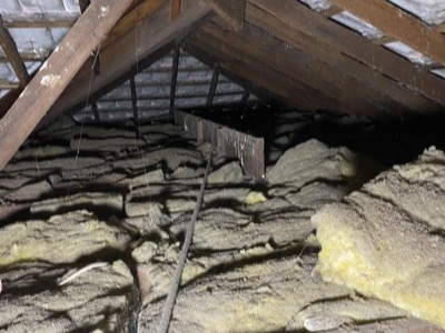 Old degraded batts in a roof space ready for removal